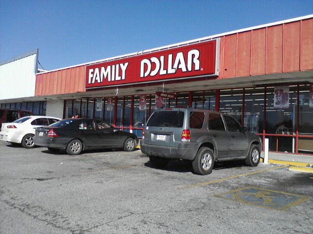 Parking lot and storefront of Family Dollar store.