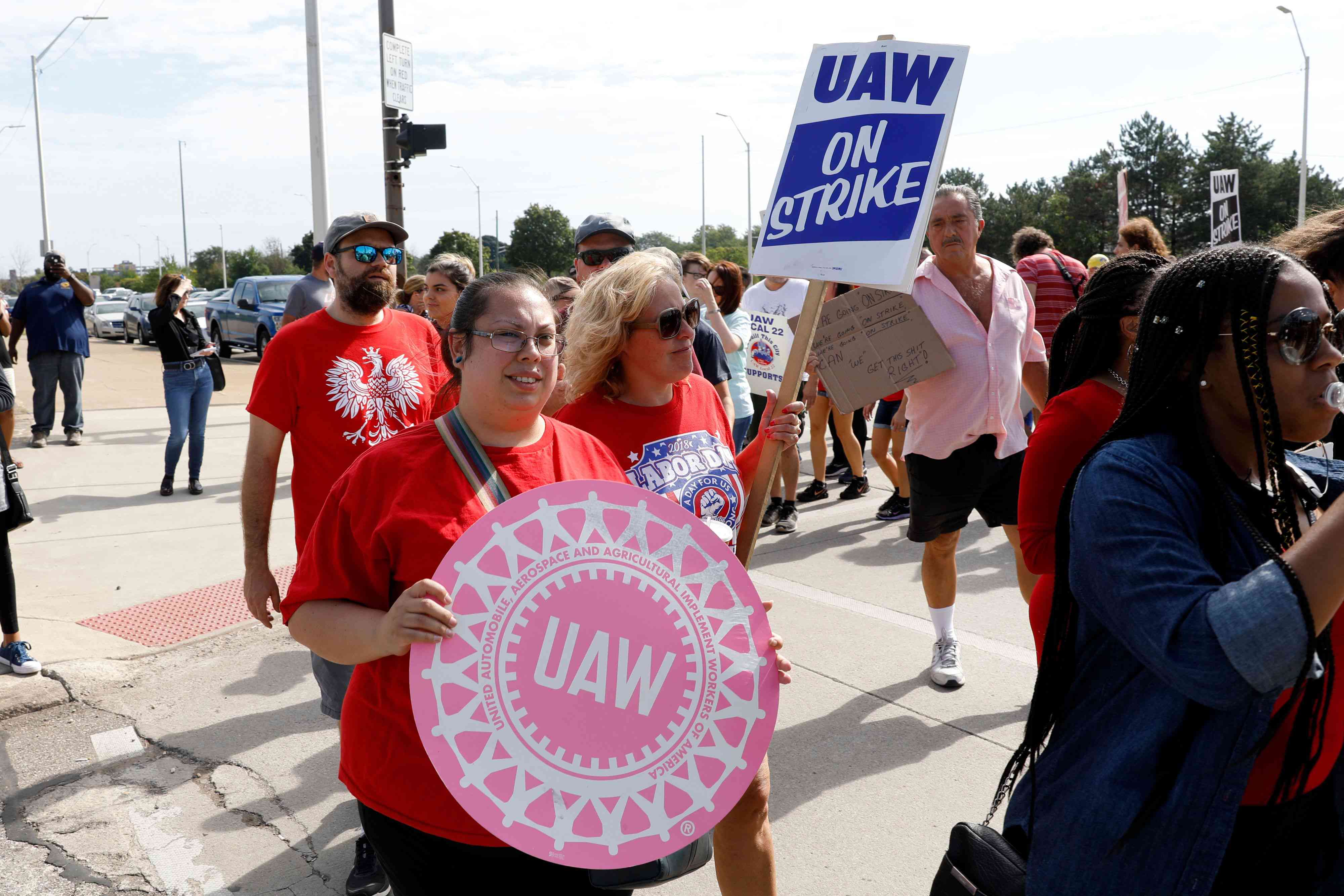 Black and white UAW picketers marching on strike