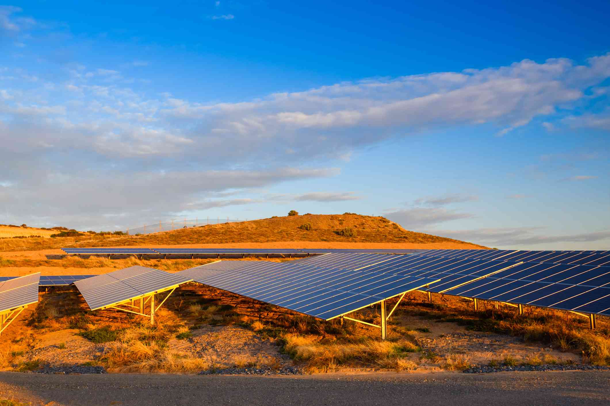 Solar panels in an orange desert landscape