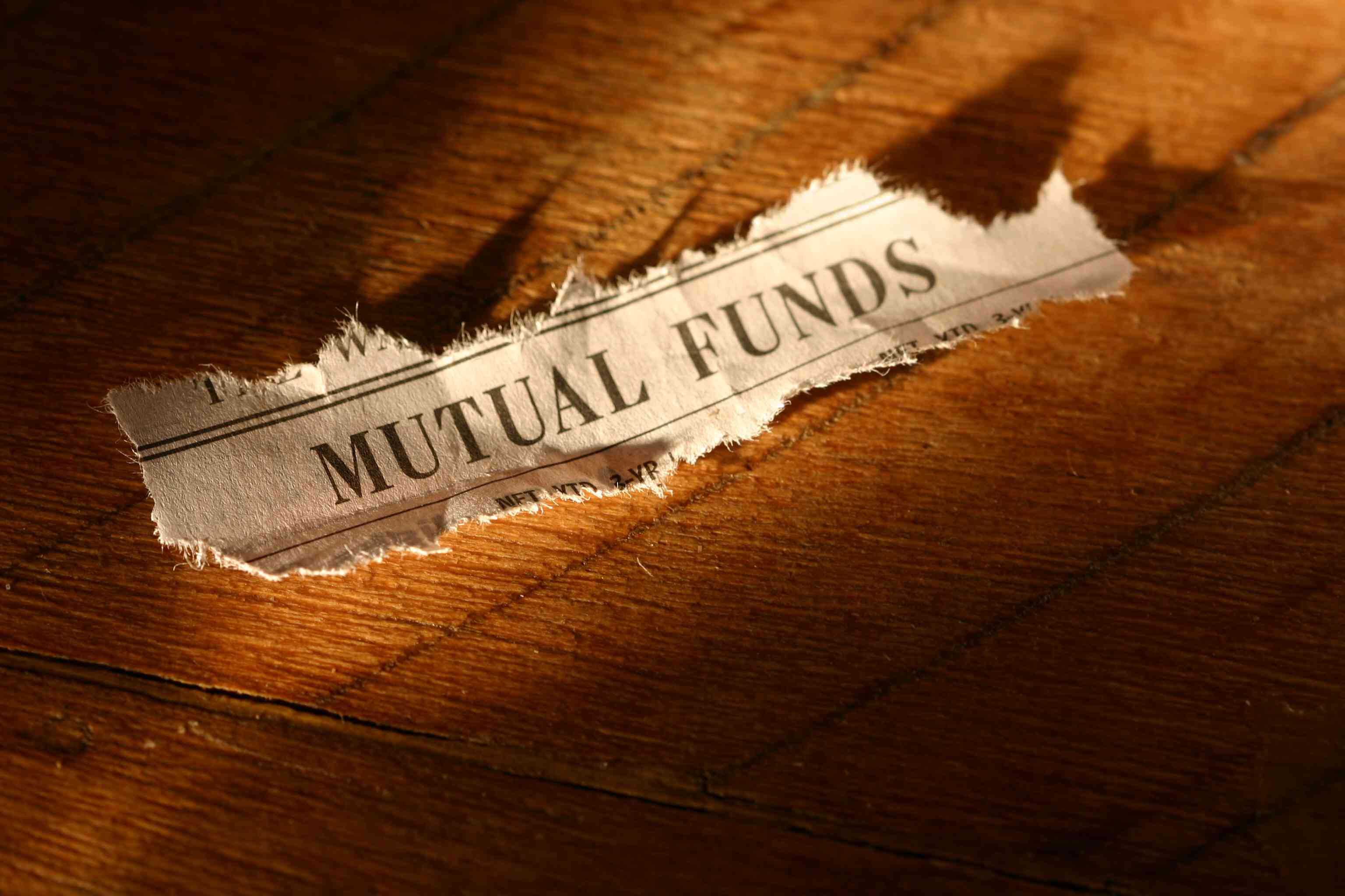 A torn Mutual Funds newspaper heading.
