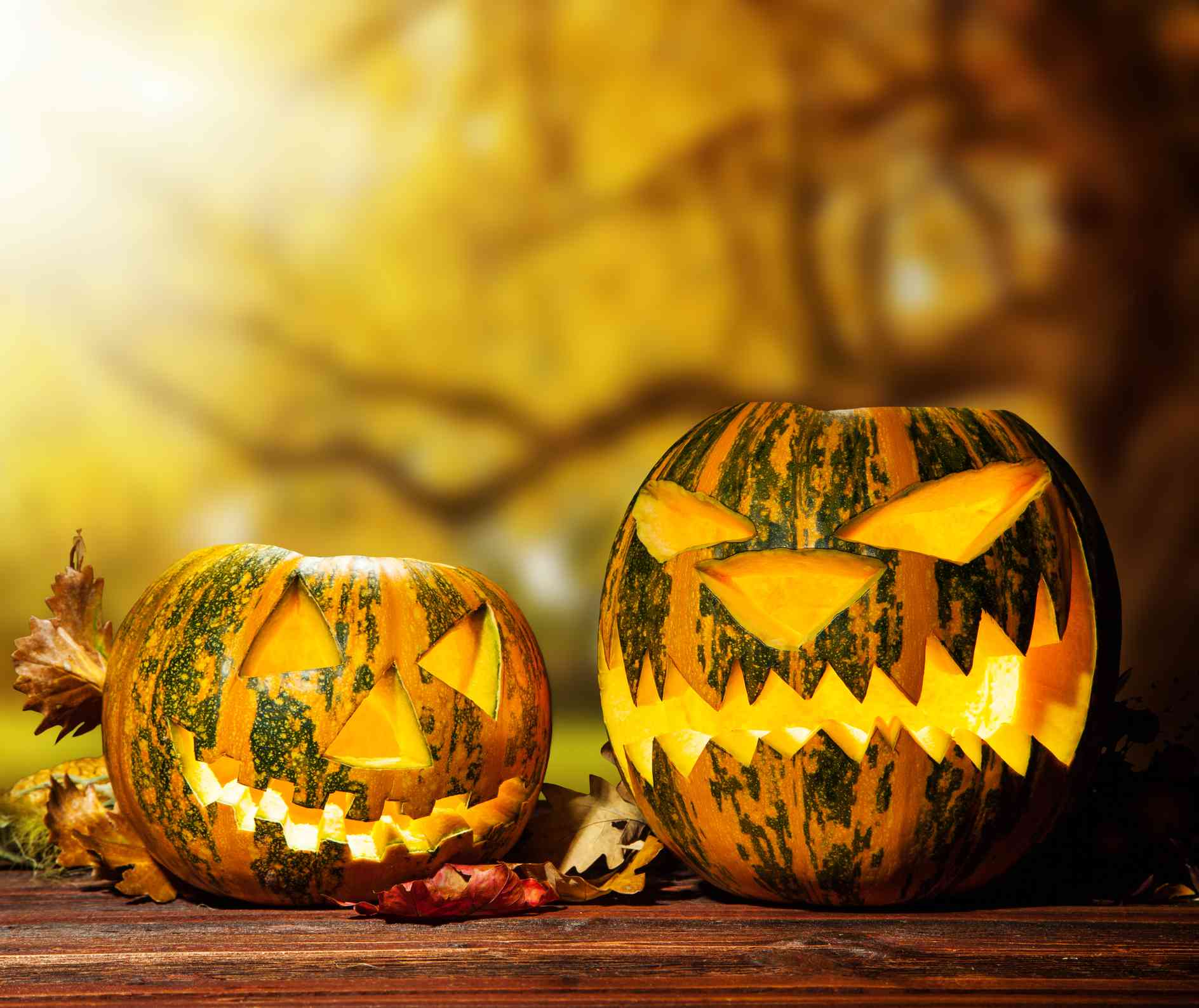 Scary halloween pumpkins on wood