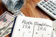 Roth IRA vs. Traditional IRA written in the notepad.